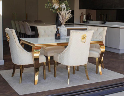 Louis Glass & Gold Dining Table With Gold Lion Knocker Quilted Velvet Chairs