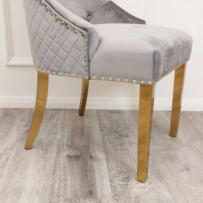 Louis Gold Marble Dining Table With Gold Quilted Lion Knocker Velvet Chairs