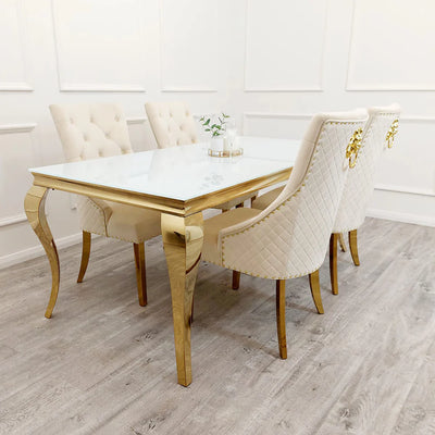 Louis Glass & Gold Dining Table With Gold Lion Knocker Quilted Velvet Chairs